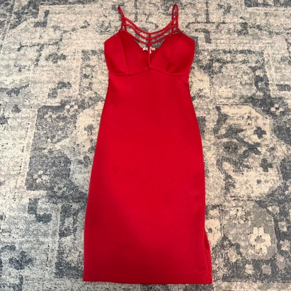 Charlotte Russe Red bodycon dress with criss cross front straps. Size: XS